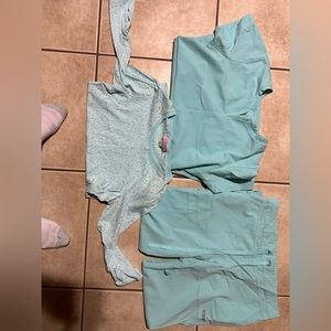 Gray’s Anatomy scrubs with a Koi under shirt.